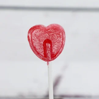 Heart-shaped red cherry-flavored lolly